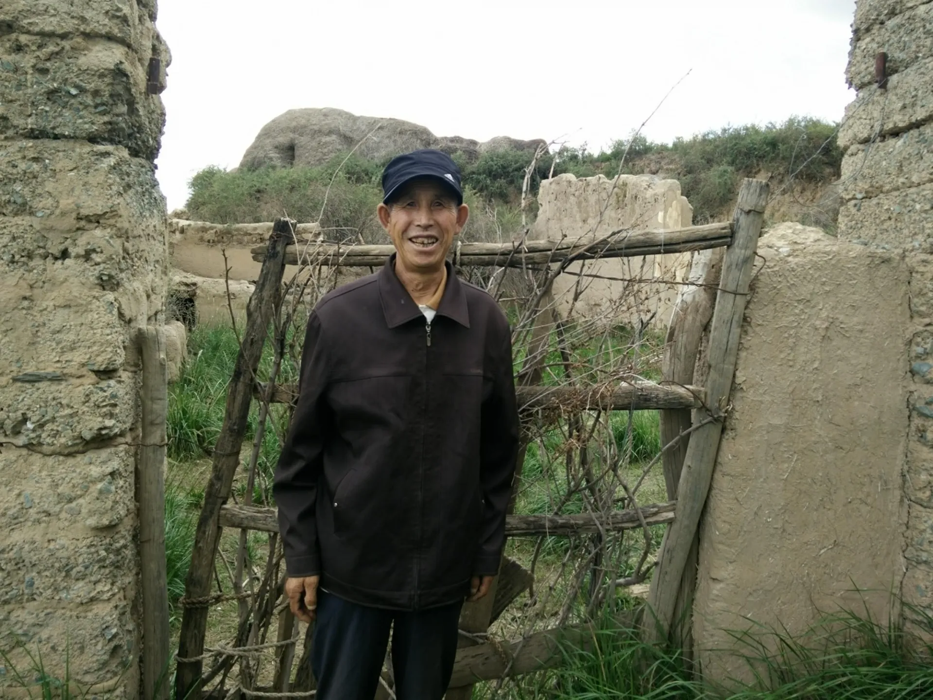 Man Visiting His Former Home In Hill Country Of Gansu Province China Alex De Sherbinin.jpg
