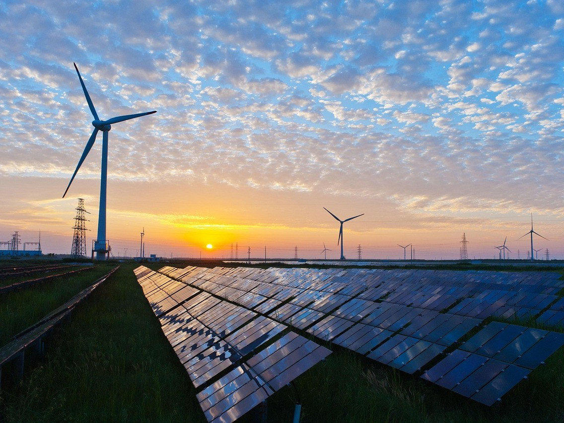 Solar panels and wind turbines. Credit: Kenueone from Pixabay
